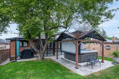 a gazebo with a pool in a yard at N7 Castle Green Retreat-Hot Tub in Toronto