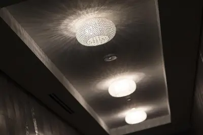 two lights on the ceiling of a room at Liberty Suites in Thornhill