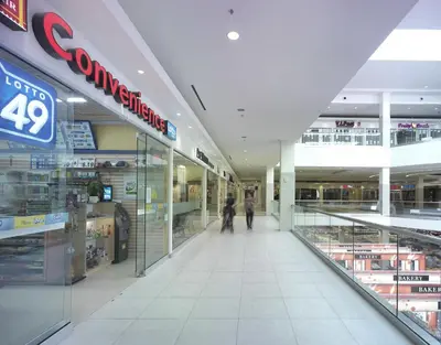 a shopping mall with people walking down the aisle at Liberty Suites in Thornhill