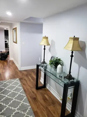 a living room with two lamps on a glass table at Luxurious 1BR - 1BA Apt Modern Bright with free parking-pc in Brampton