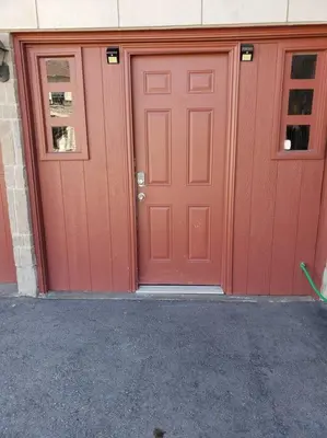 a pair of red doors on a building at Luxurious 1BR - 1BA Apt Modern Bright with free parking-pc in Brampton