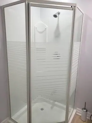 a shower with a glass door in a bathroom at Luxurious 1BR - 1BA Apt Modern Bright with free parking-pc in Brampton