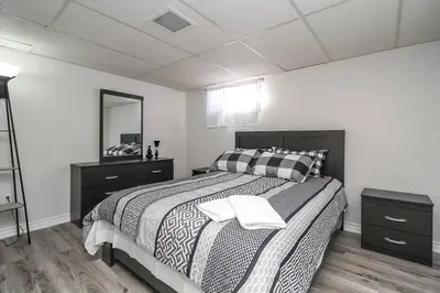 a bedroom with a bed with two towels on it at Farm House in Coldwater