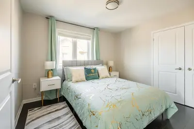 a bedroom with a bed and a window at GlobalStay 3 Bedroom House with Parking Brampton in Brampton