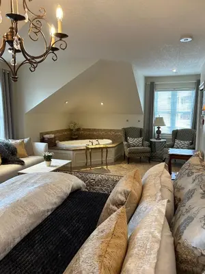 a living room with a couch and a table at Norfolk Guest House Inn in Guelph