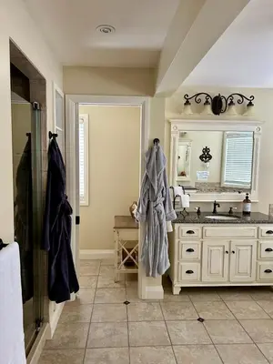 a bathroom with a sink and a mirror at Norfolk Guest House Inn in Guelph