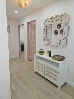 a room with a table and a mirror on the wall at Riverfront Cottage Sauna Canoe Included Kids Playroom Nature Escape in Wasaga Beach