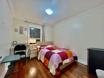 a bedroom with a bed and a desk and a window at Toronto Uptown 1 - Bus to Downtown in Toronto