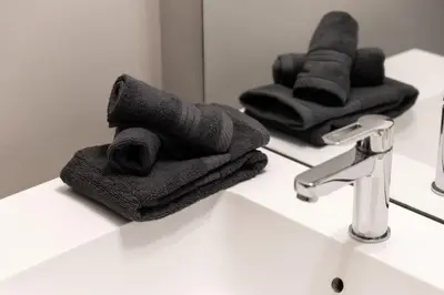 a bathroom with a sink with towels on a counter at City Serenity 1 Bedroom with Balcony in Toronto