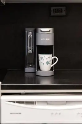 a coffee maker and a cup on top of a counter at City Serenity 1 Bedroom with Balcony in Toronto