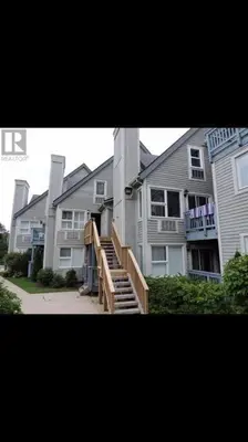 a large apartment building with a staircase in front of it at Blue Mountain Escape, WIFI, Base of North lift in Blue Mountains