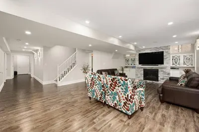 a living room with a couch and a fireplace at Walk-out Basement Apartment with Private Entrance in Brampton