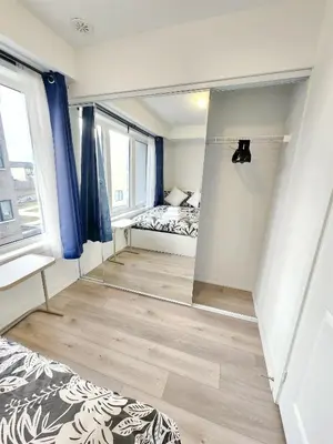 a bedroom with a bed and a mirror at King Bed TV Private Ensuite Retreat Bathroom or Economical Double Bed Room in Toronto