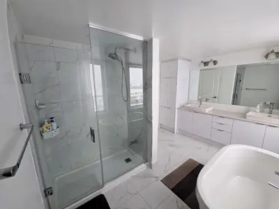 a bathroom with a shower and a sink at King Bed TV Private Ensuite Retreat Bathroom or Economical Double Bed Room in Toronto