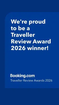 a blue sign that says were proud to be a traveller reviewagency winner at Exquisite, Bright & Modern Condo - Free Parking in Niagara Falls