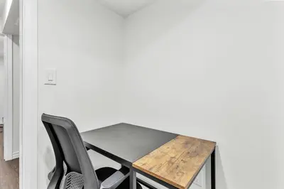 a table and two chairs in a room at Modern 1 Bedroom + Den in Cambridge in Cambridge