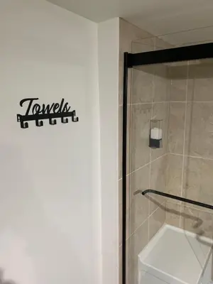 a bathroom with a shower stall and a toilet at Modern 1 Bedroom + Den in Cambridge in Cambridge