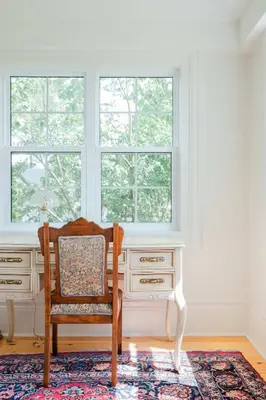 a desk and chair in a room with a window at Little Louis - A Princely Take on a County Getaway in Mountain View