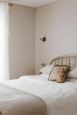 a bedroom with a bed with a pillow on it at Little Louis - A Princely Take on a County Getaway in Mountain View