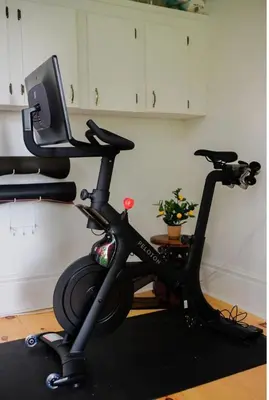 a black exercise bike sitting in a room at Little Louis - A Princely Take on a County Getaway in Mountain View