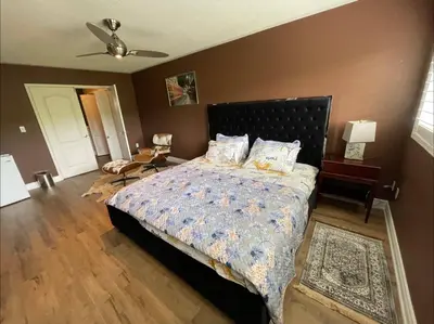 a bedroom with a bed and a ceiling fan at Beautiful Master bedroom unit with private washroom in Mississauga