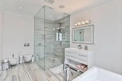 a white bathroom with a shower and a sink at Luxurious Spa Retreat - Toronto Escape in Toronto