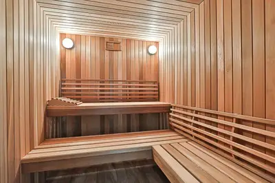 a sauna with wood paneled walls and a wooden floor at Luxurious Spa Retreat - Toronto Escape in Toronto
