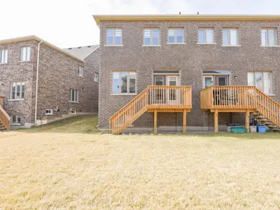 two decks in front of a brick building at Stylish Home in Waterdown in Hamilton