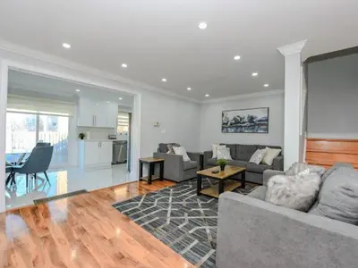 a living room with a couch and a table at Elegant Home in Mississauga in Mississauga