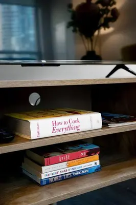 a stack of books sitting on a shelf at Chic 1-BR Condo; Parking included; Downtown Core in Toronto