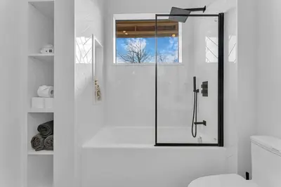 a shower with a glass door in a bathroom at Sherkston Oasis - Hot Tub Soaks & Luxurious Escape in Port Colborne