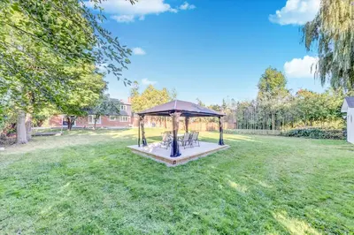 a gazebo in the middle of a yard at Stunning 7 Br RougeView Home with 2 Kitchens, 5 Bathrooms, Amazing Backyard & 8-Car Parking in Toronto