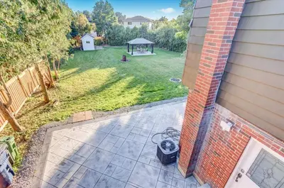 an aerial view of a backyard with a gazebo at Stunning 7 Br RougeView Home with 2 Kitchens, 5 Bathrooms, Amazing Backyard & 8-Car Parking in Toronto