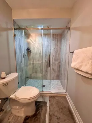 a bathroom with a shower and a toilet at SUITE A 2 Bedroom Apartment in Brampton
