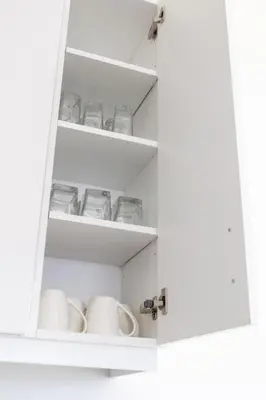 a cupboard filled with lots of glasses and dishes at Comfortable Lux, Sleeps 10, PingPong, Movie Room in London