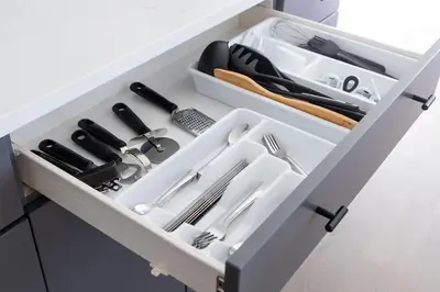 a white drawer with utensils in it at Comfortable Lux, Sleeps 10, PingPong, Movie Room in London