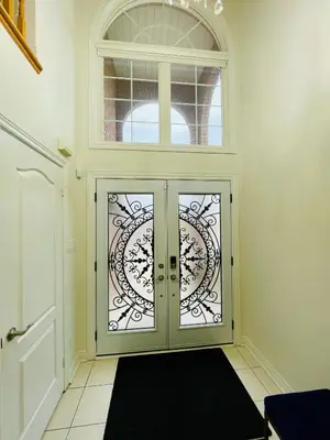 a doorway with a glass door with a window at Homestay- private room and bathroom in Whitby