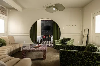 a living room with a couch and a table at Hotel Julie in Stratford