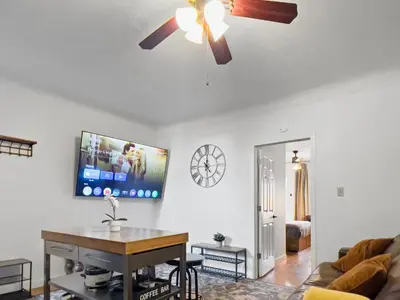 a living room with a ceiling fan and a couch at Cozy 2 Bedroom 2 Bathroom with Parking in Toronto