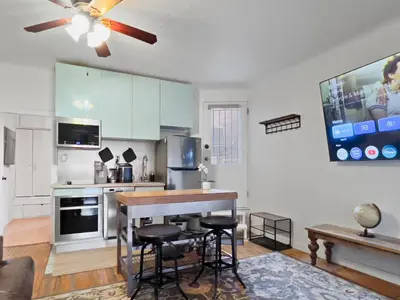 a kitchen with a table and some chairs in it at Cozy 2 Bedroom 2 Bathroom with Parking in Toronto