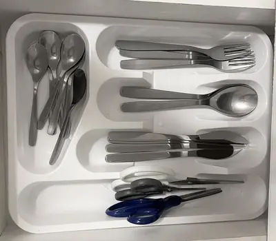 a drawer full of silver utensils in a refrigerator at Cozy Lovely Ravine facing Suite. in Mississauga