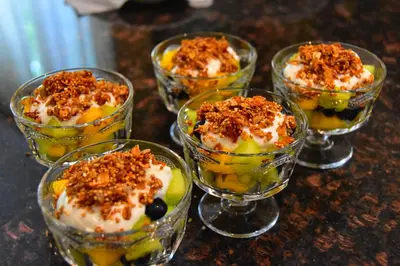 a group of glass cups filled with desserts on a table at Explorer House Bed & Breakfast in Niagara on the Lake