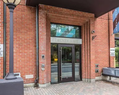 a brick building with a entrance to a university shop at The Saint James Hotel, an Ascend Collection Hotel in Toronto