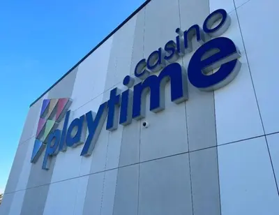 a company sign on the side of a building at Charming riverside cottage, walk to beach in Wasaga Beach