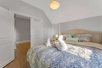 two white stuffed animals sitting on top of a bed at Hidden Oasis with Hot Tubs, & Starry Fire Pits in Borden