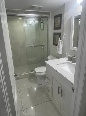 a bathroom with a shower and a toilet and a sink at Zen Nest in Brampton