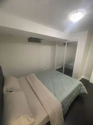 a bedroom with a bed in a room at Zen Nest in Brampton