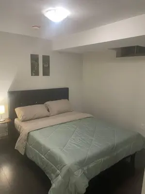 a bedroom with a bed in a room at Zen Nest in Brampton