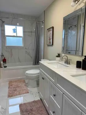a bathroom with a sink and a toilet and a shower at Vacation paradise in St. Catharines