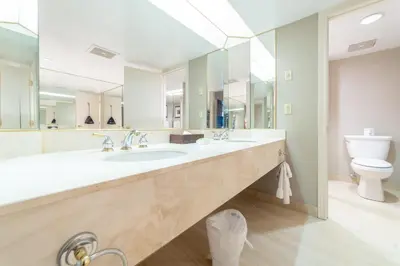 a large bathroom with two sinks and a toilet at Horseshoe Valley Suites - The Azure in Shanty Bay